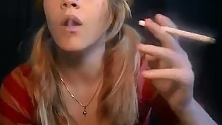 The insanely beautiful Mika blowing oh so thick and hot smoke!