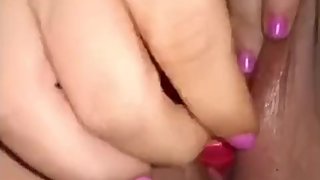 a Latina masturbates with a dildo until she has an orgasm